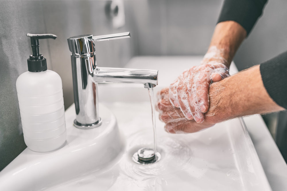 washing, hands, in, a, sink